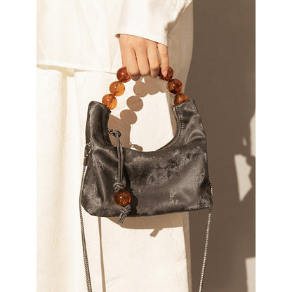 Bolso bandolera con cadena de perlas y hombro Niche