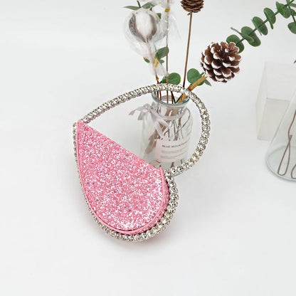 Diamond studded dinner bag with diamond heart-shaped clutch