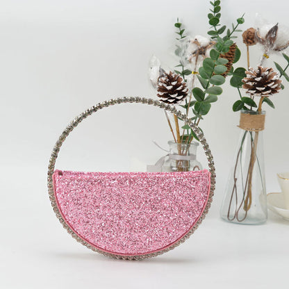 Diamond studded dinner bag with diamond heart-shaped clutch