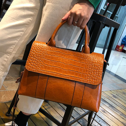 Bolso de mano de cuero puro de gran capacidad, estilo europeo y americano, popular para primavera y verano, venta al por mayor