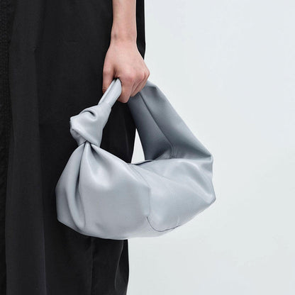 Bolso de mano sencillo, versátil y elegante para llevar debajo del brazo