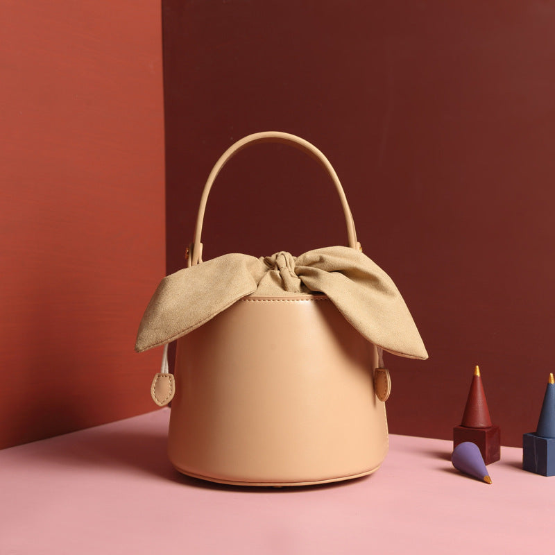 Leather bow bucket bag