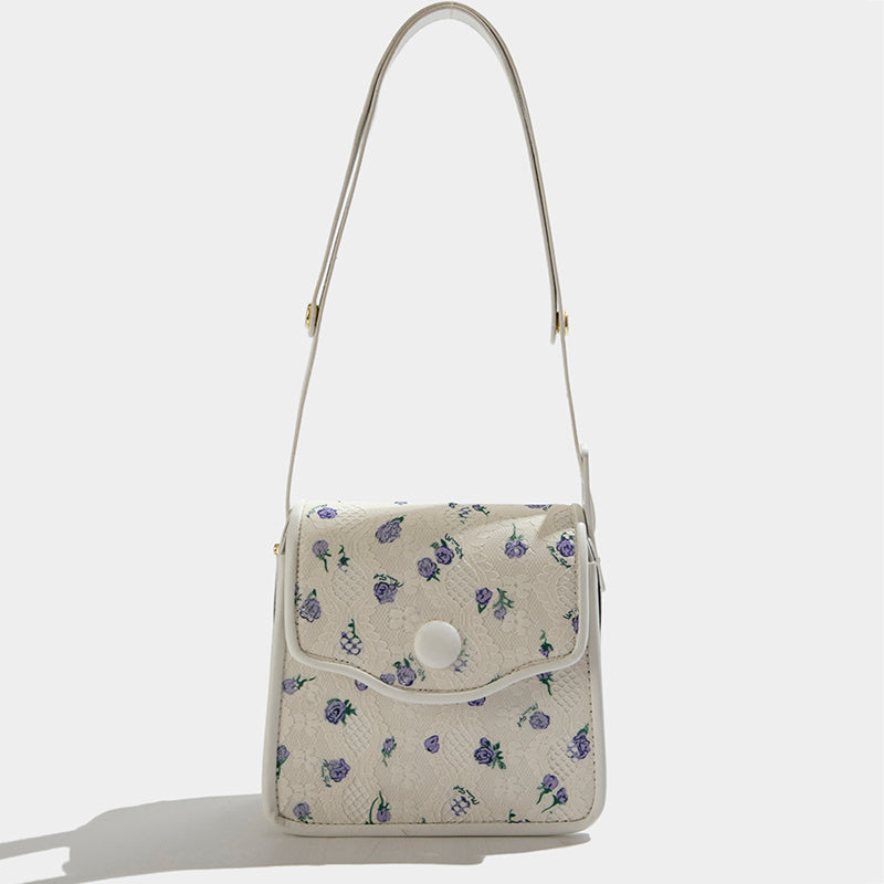 Bolso de mensajero con flores texturizado de este año, el popular nicho