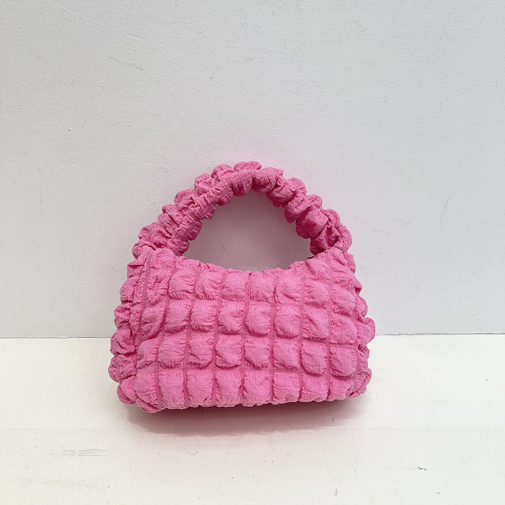 Bolso de mano estilo occidental con pliegues suaves y burbujas