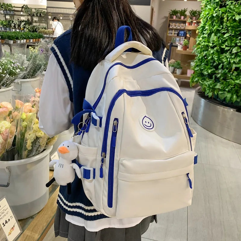 2024 nouvelle version du sac à dos de couleur unie minoritaire automne nouveaux lycéens grande capacité cartable multi-poches femme