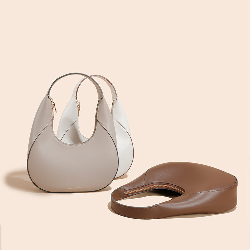 Sac à bandoulière polyvalent pour femme au design spécial en cuir véritable de haute qualité