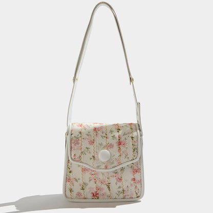 Bolso de mensajero con flores texturizado de este año, el popular nicho