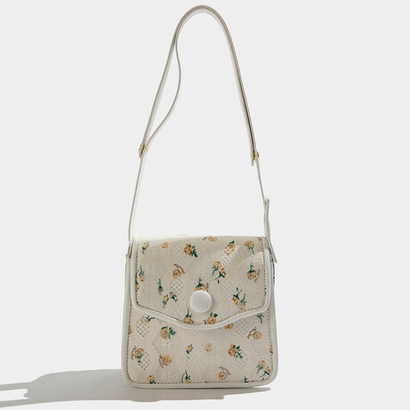 Bolso de mensajero con flores texturizado de este año, el popular nicho